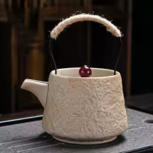 Teapot Cream — marbled porcelain, built-in strainer | HAY